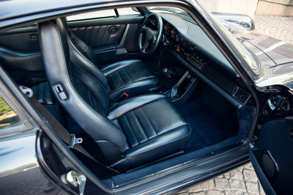 Vintage car's luxurious black leather interior view
