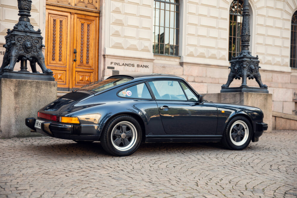 Vintage Porsche 911 outside Finland's Bank building
