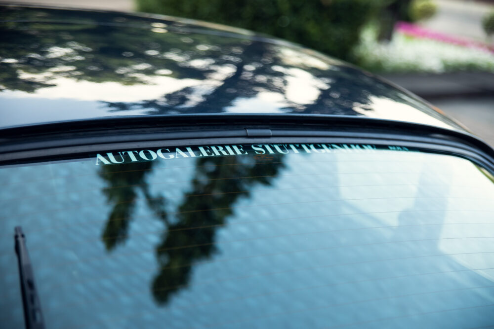 Car rear window with 'Autogalerie Stuttgart' sticker