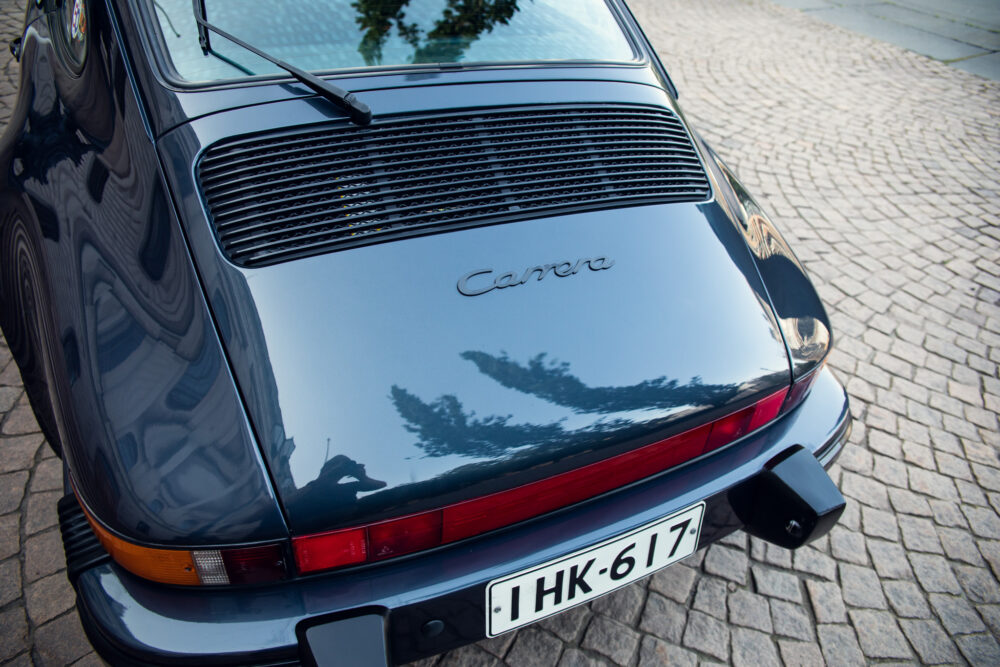 Rear view of Porsche Carrera with license plate HK-617