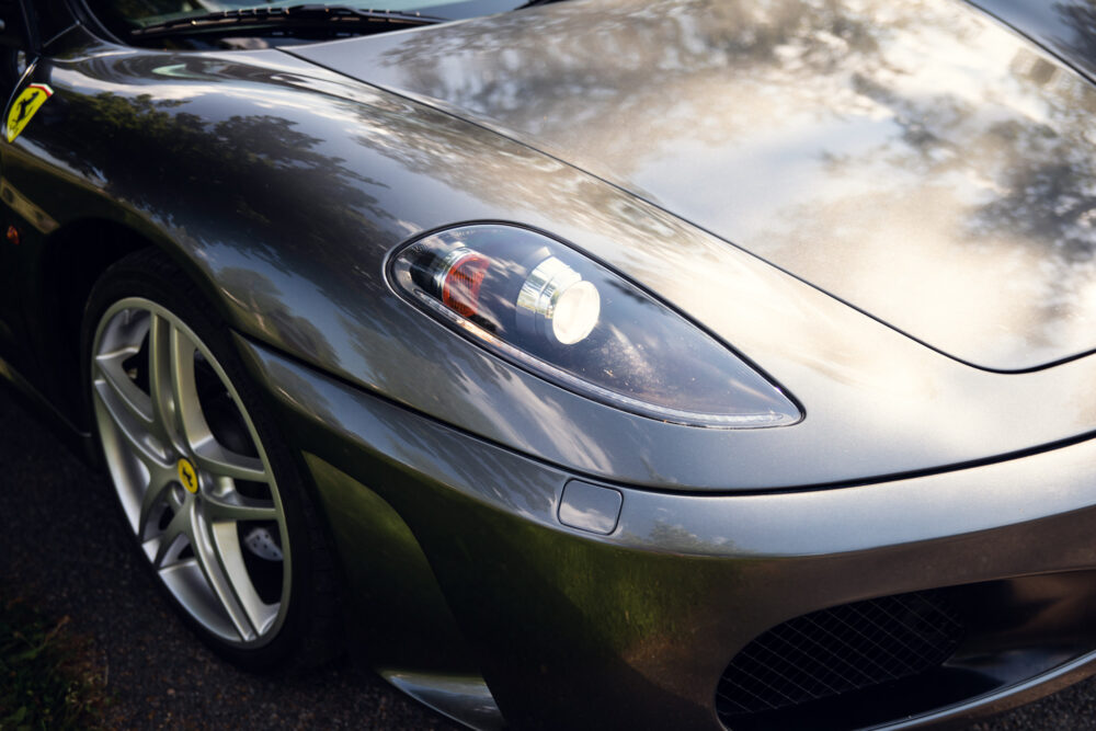 Close-up of a sleek silver Ferrari's front end