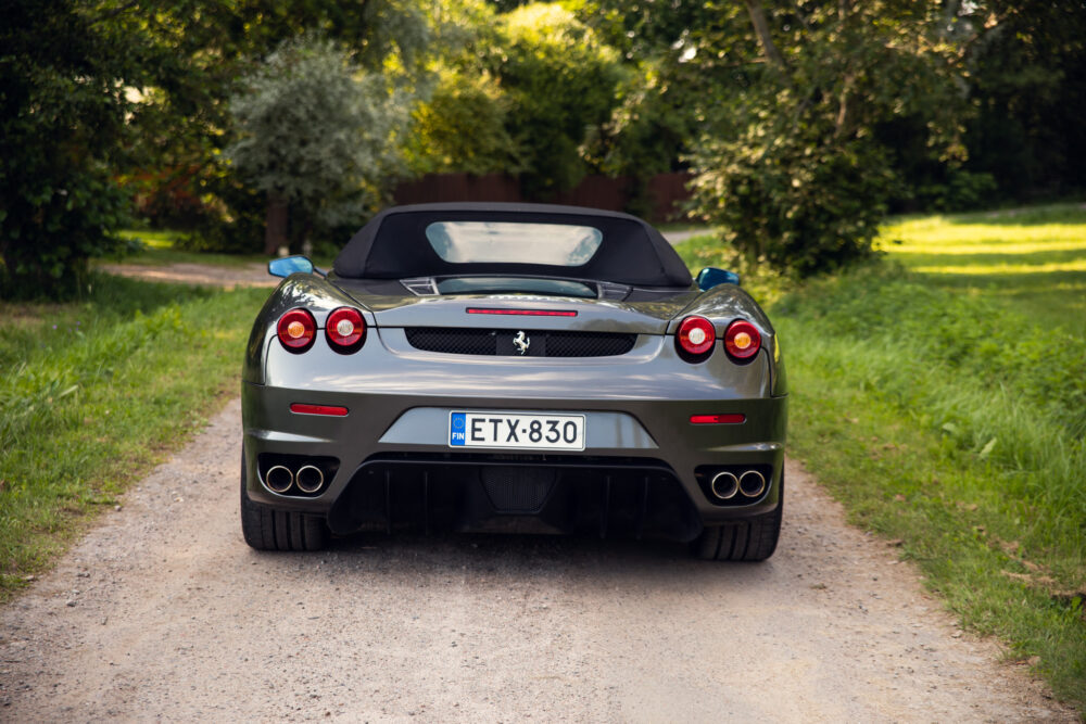 Silver convertible sports car on a rural road