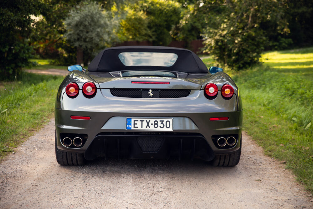 Silver Ferrari convertible on rural road