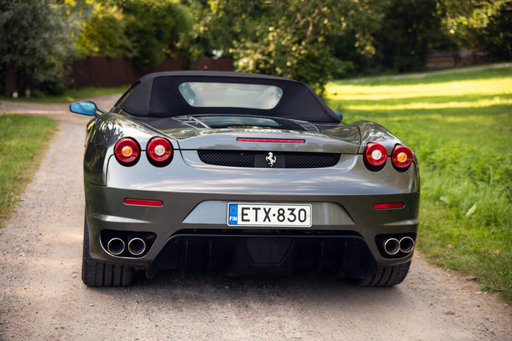 Silver convertible sports car on a rural road