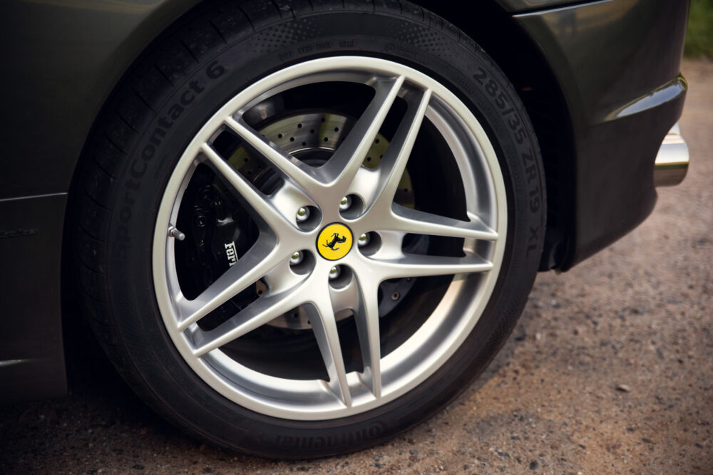 Close-up of car wheel with branded logo