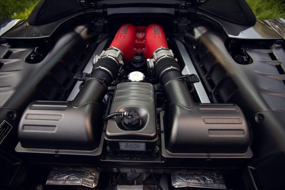 Close-up of modern car engine with red cylinders