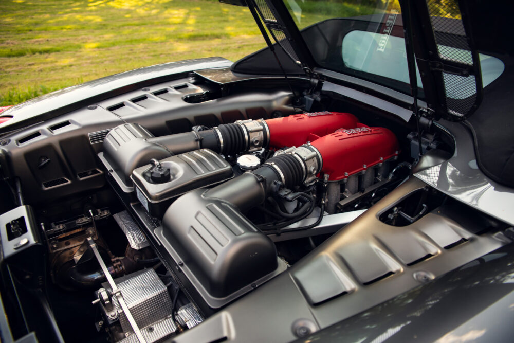 Detailed view of car engine with red covers