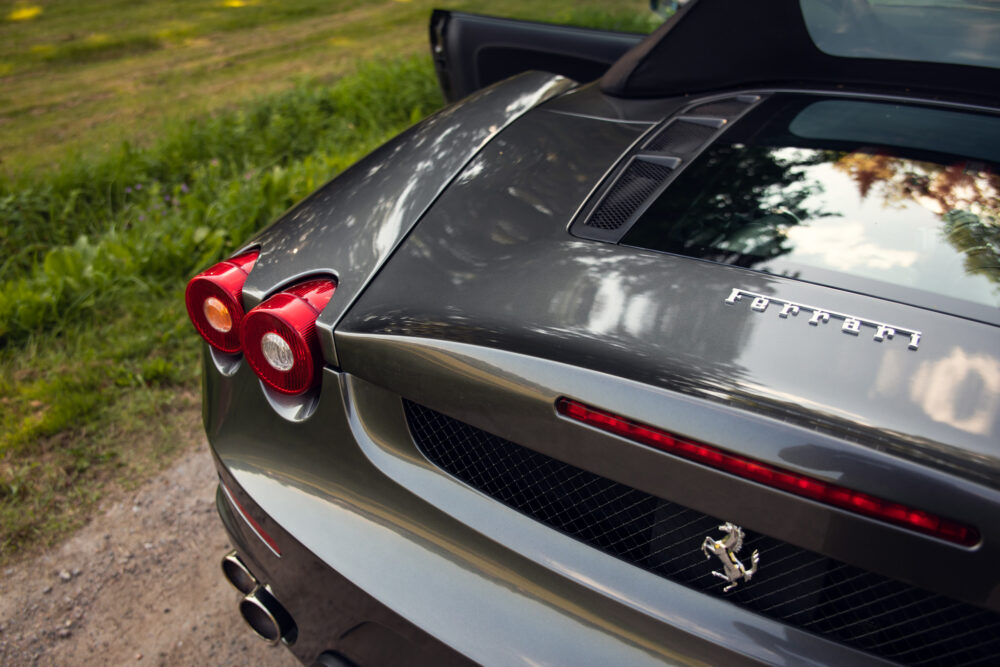 Close-up of gray Ferrari car rear and logo