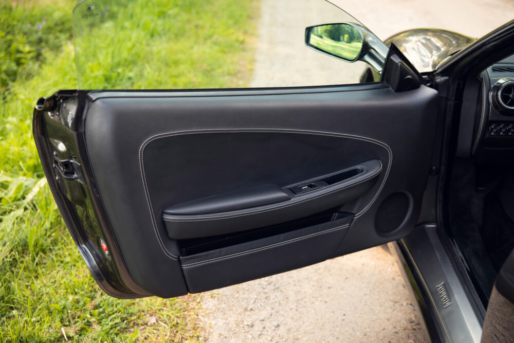 Open car door interior with leather details