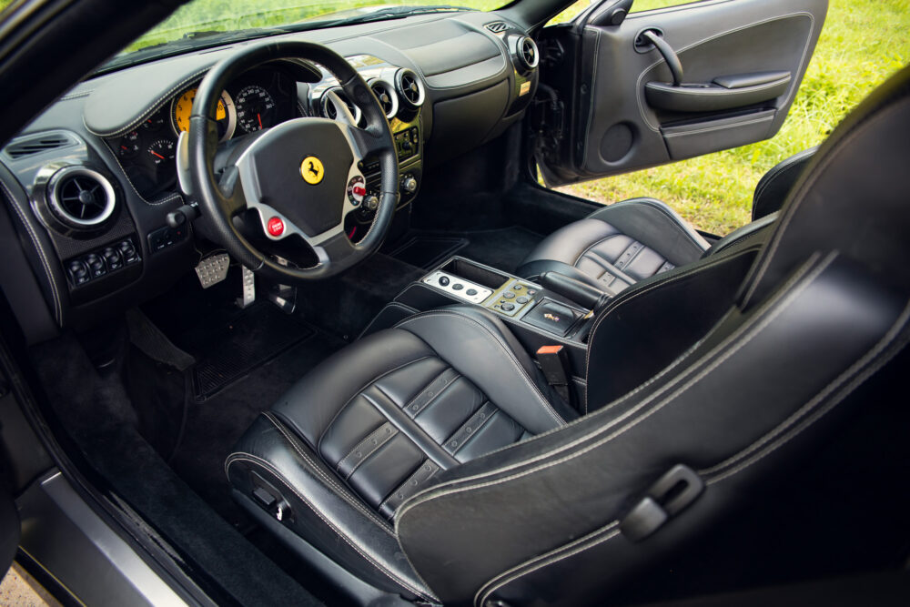 Luxurious Ferrari interior, leather seats and modern dashboard.