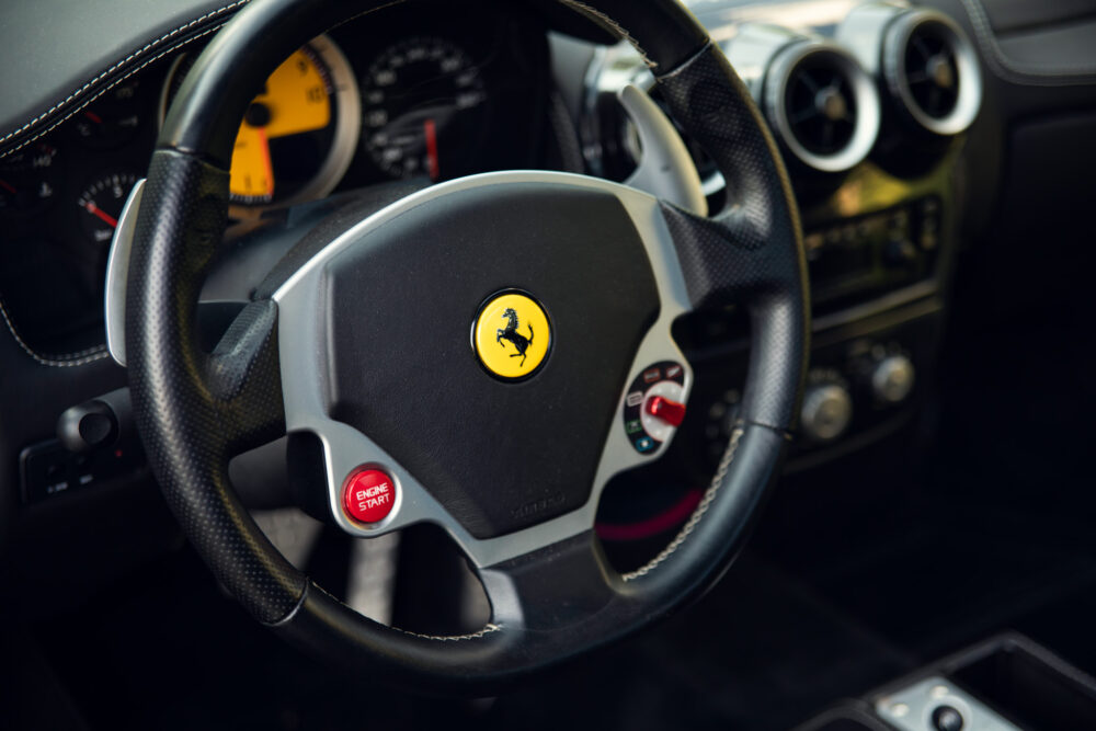Close-up of Ferrari steering wheel and dashboard