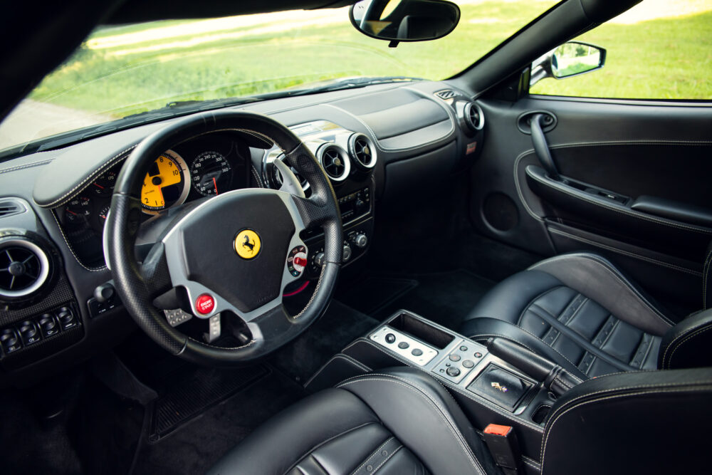 Luxury Ferrari interior with leather seats and dashboard