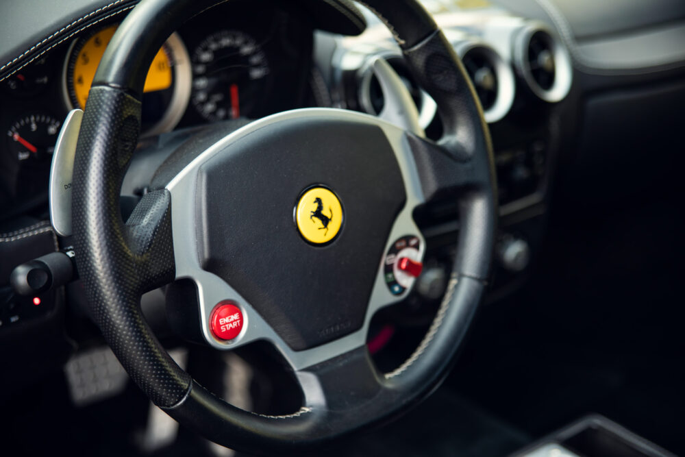 Close-up of Ferrari steering wheel with logo