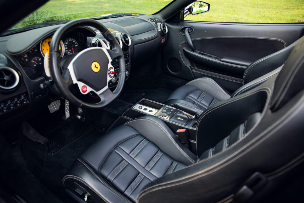 Luxurious black leather interior of a Ferrari sports car