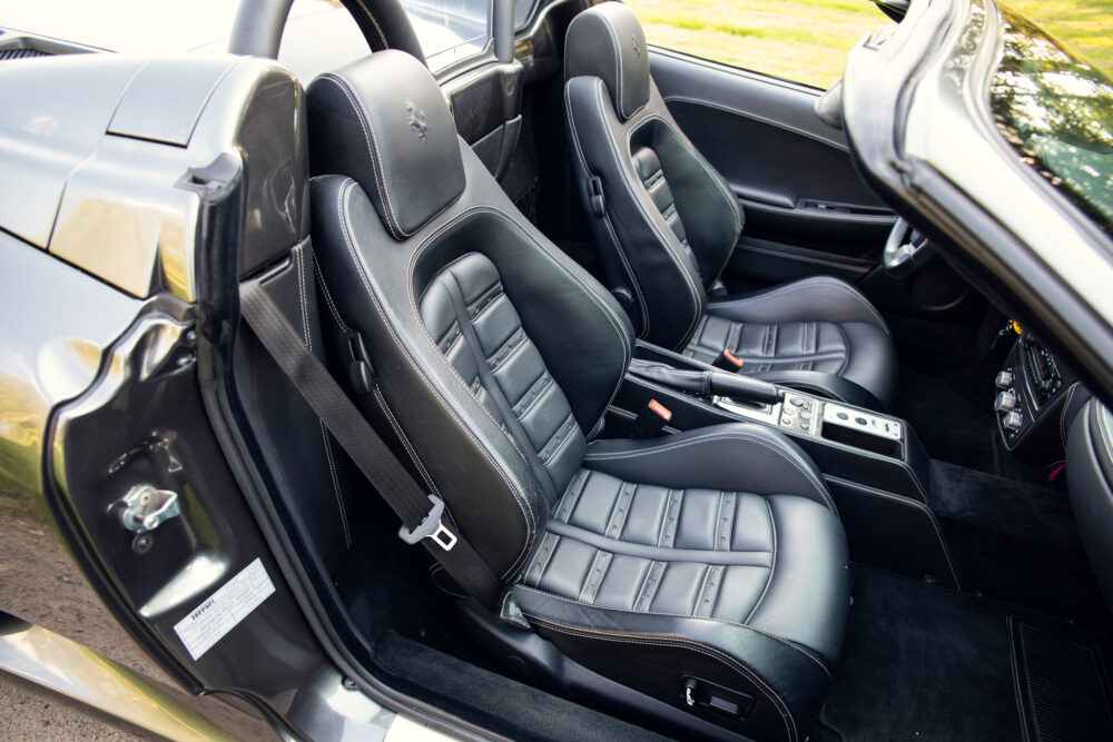Luxurious black leather car interior with sporty design