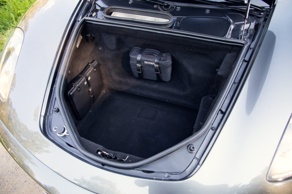 Car trunk with two black leather bags