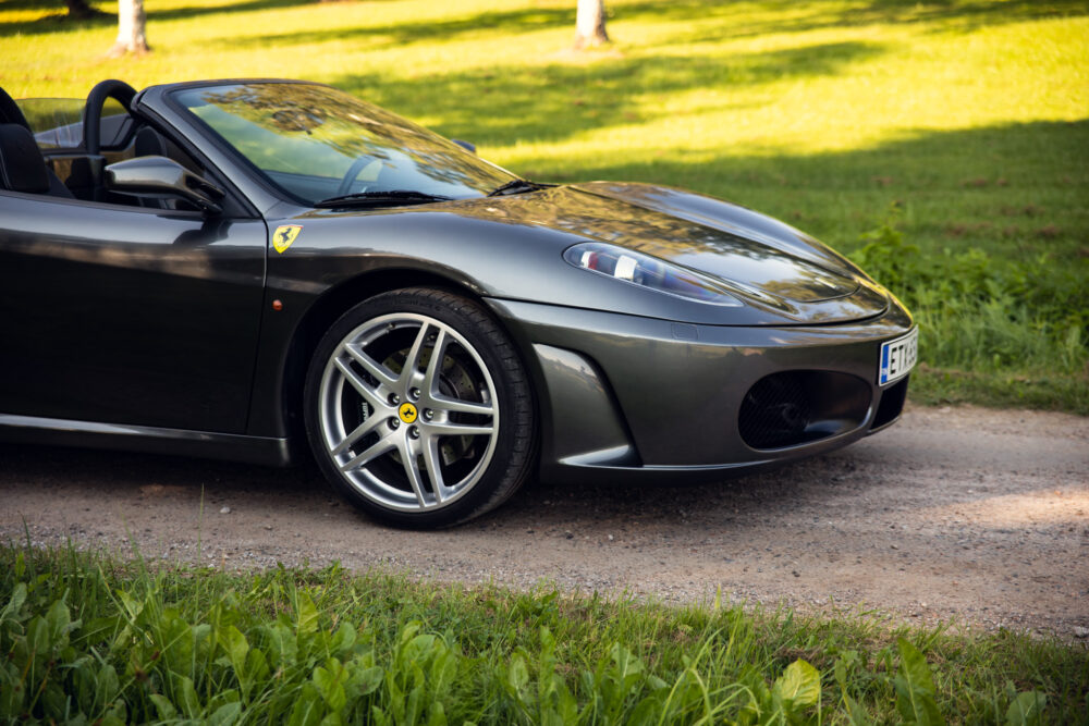 Black Ferrari convertible parked outdoors