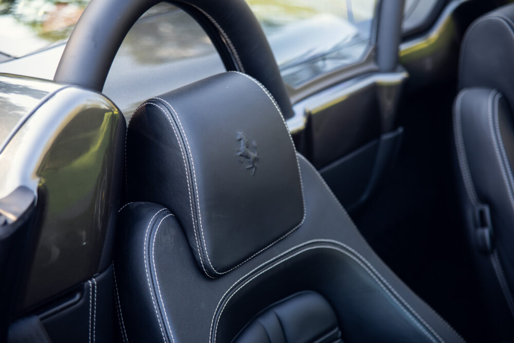 Luxury car black leather seats with embossed horse logo