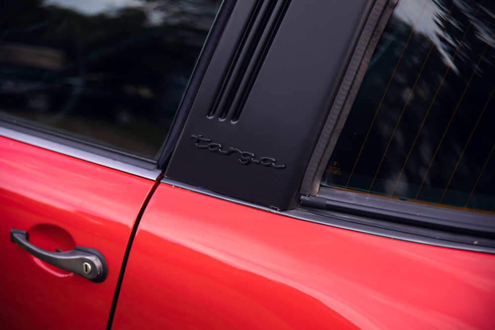 Red vintage Porsche Targa door detail
