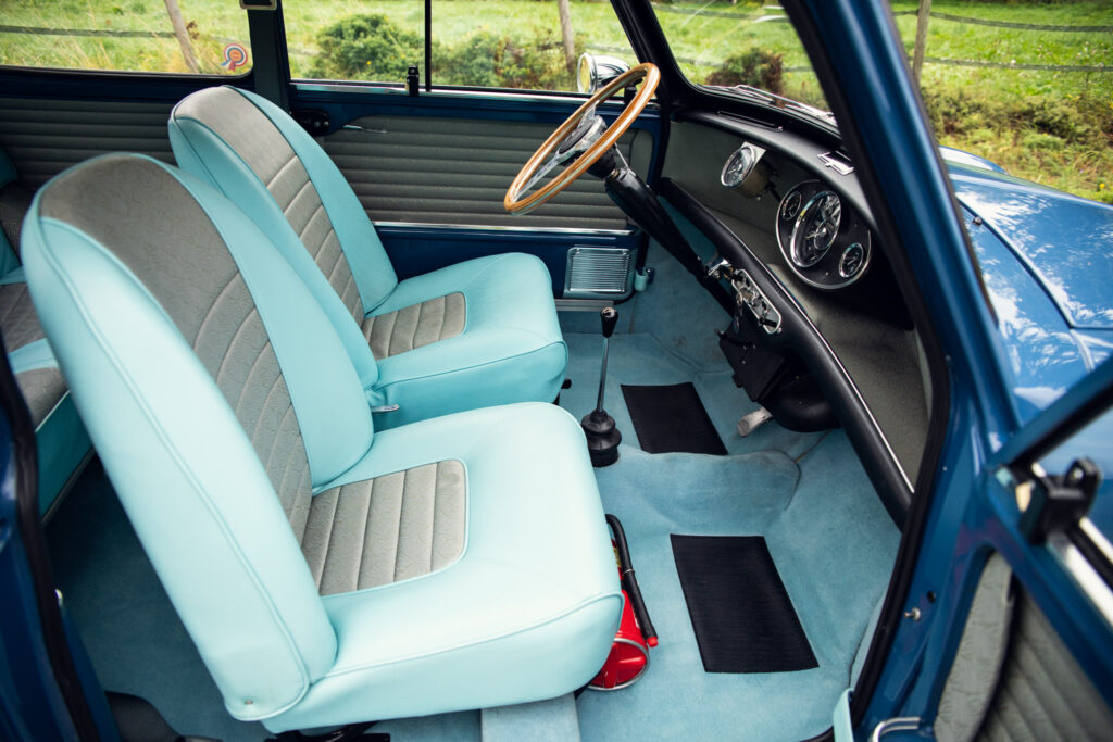 Vintage car interior with blue and white seats