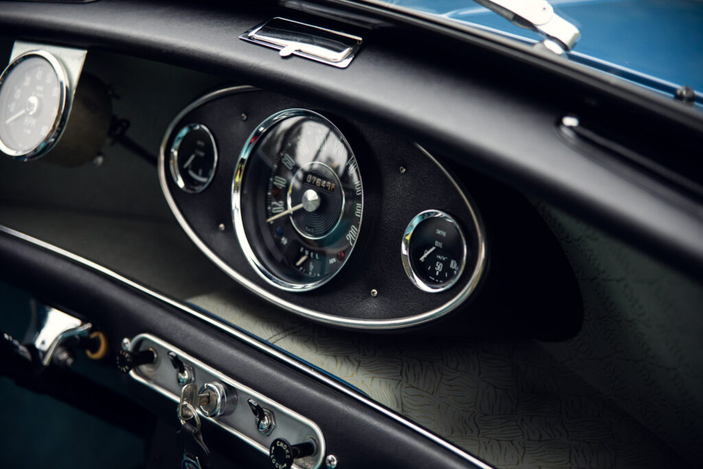 Vintage car dashboard with sleek gauges and chrome details