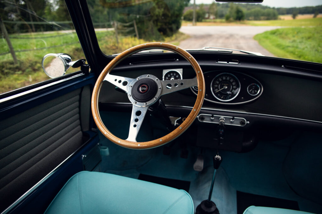 Vintage car interior with wooden steering wheel