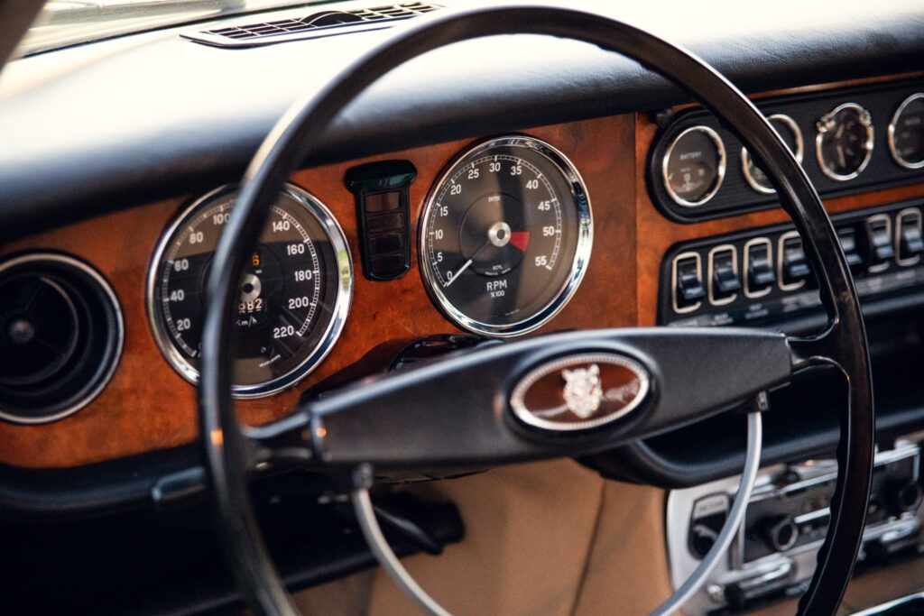 Vintage car dashboard with wooden panel and gauges