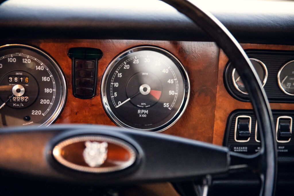 Classic car dashboard with vintage speedometer and RPM gauge