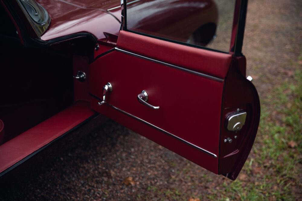 Vintage red car door open showing interior