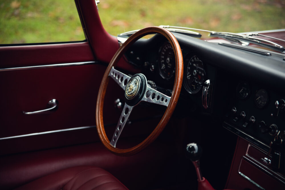 Vintage car interior with wooden steering wheel