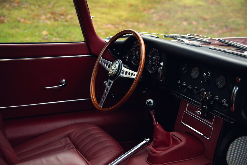 Vintage car interior with wooden steering wheel