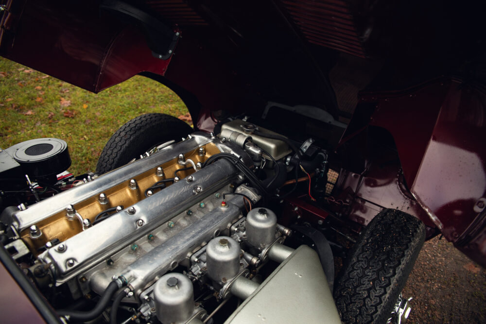 Vintage car engine exposed under raised hood