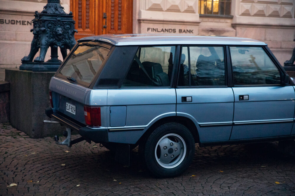 Vintage car parked near Finlands Bank building