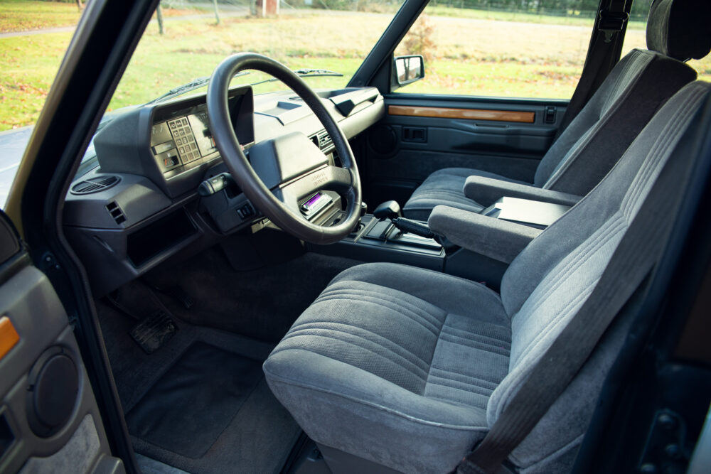 Vintage car interior with grey upholstered seats