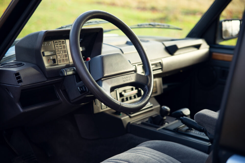 Vintage car dashboard with steering wheel and controls