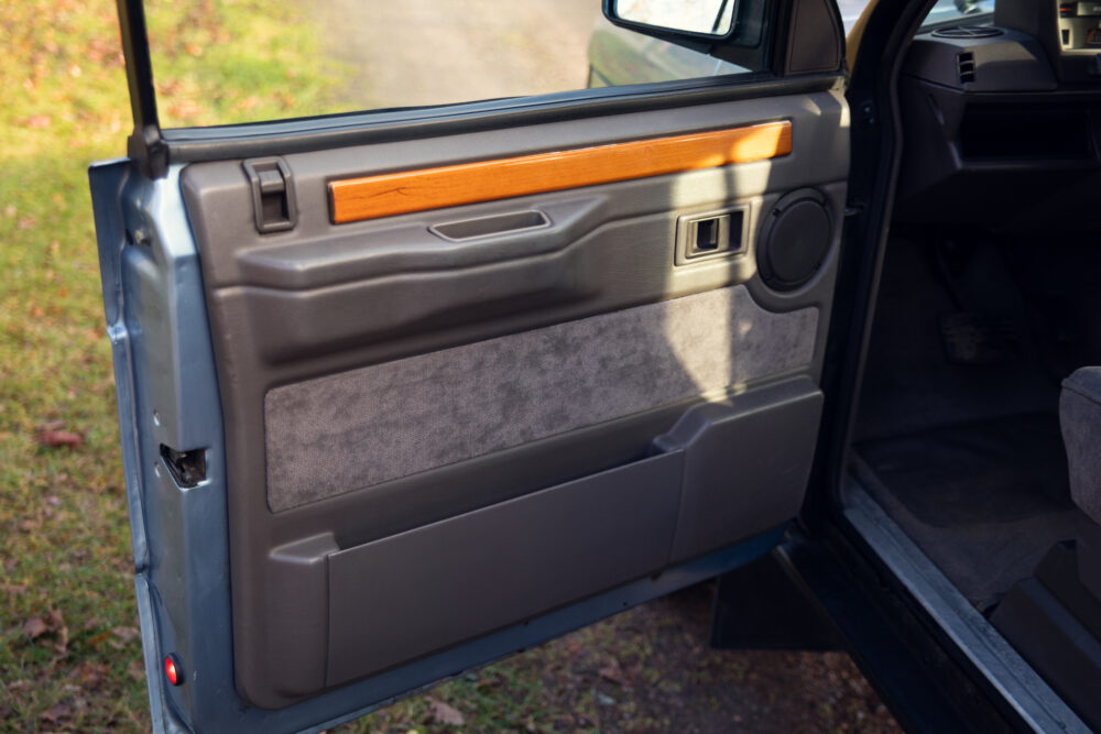 Vintage car's open door showing detailed interior design