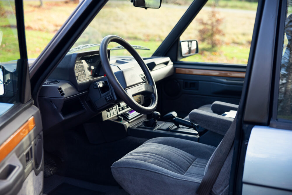 Vintage car interior with steering wheel and dashboard