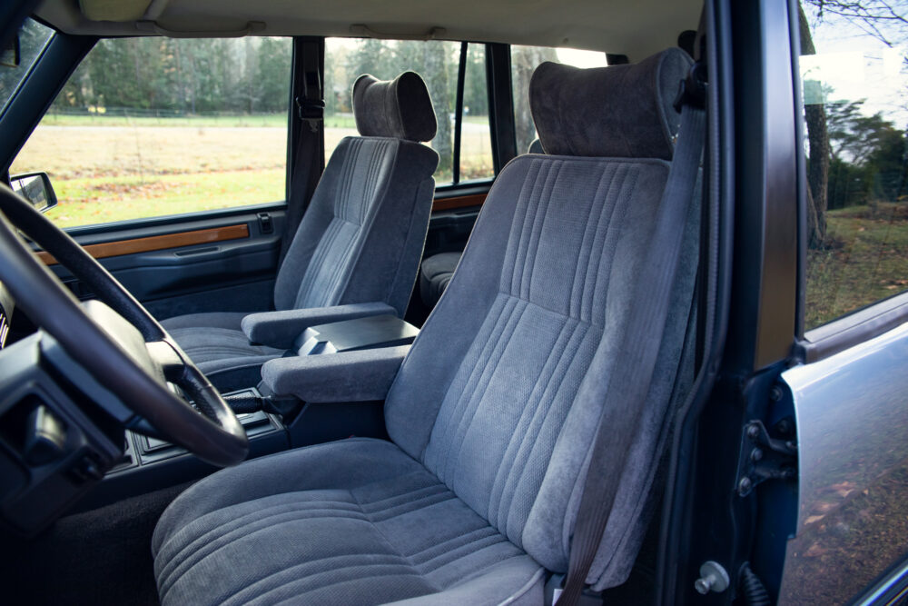Vintage car interior with plush grey seats