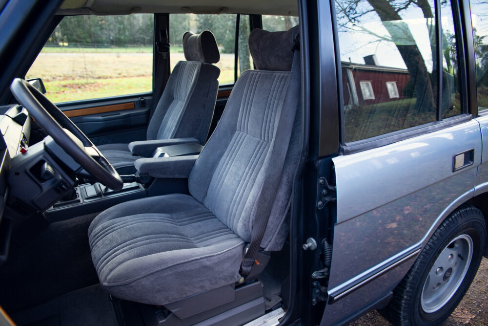 Vintage car interior with gray fabric seats