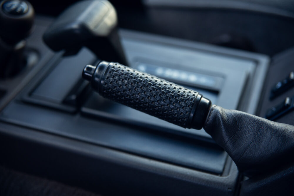 Close-up of a car's manual gearshift handle