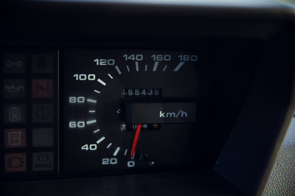 Close-up of car speedometer showing zero km/h