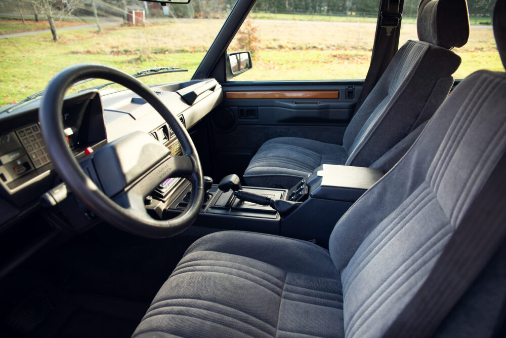 Vintage car interior with blue fabric seats