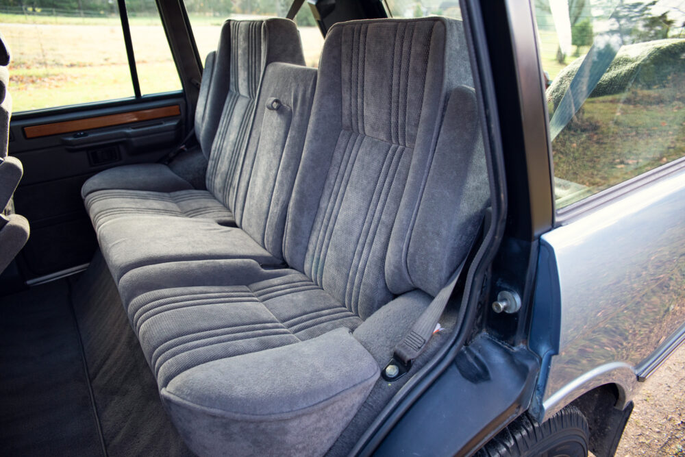 Interior view of vintage car's plush rear seat