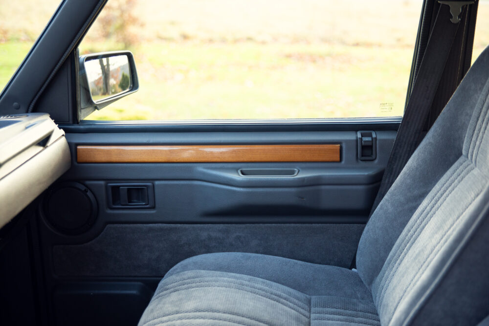 Vintage car's interior with focus on door and seat