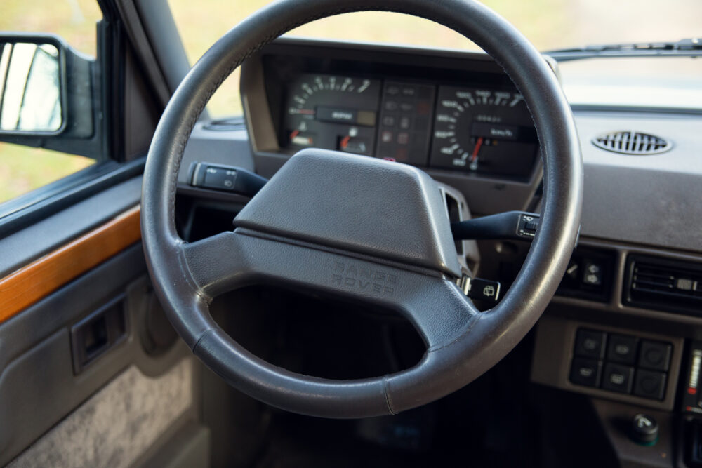 Vintage Range Rover steering wheel and dashboard view