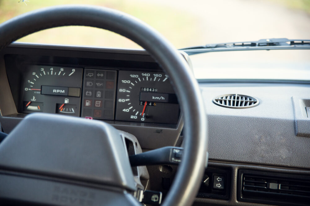 Close-up of vintage car dashboard and steering wheel