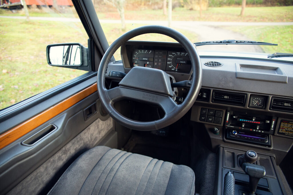 Vintage car dashboard and steering wheel interior