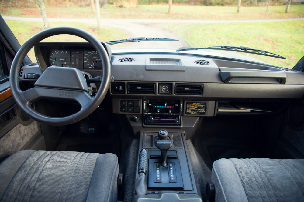 Vintage car interior with steering wheel and dashboard