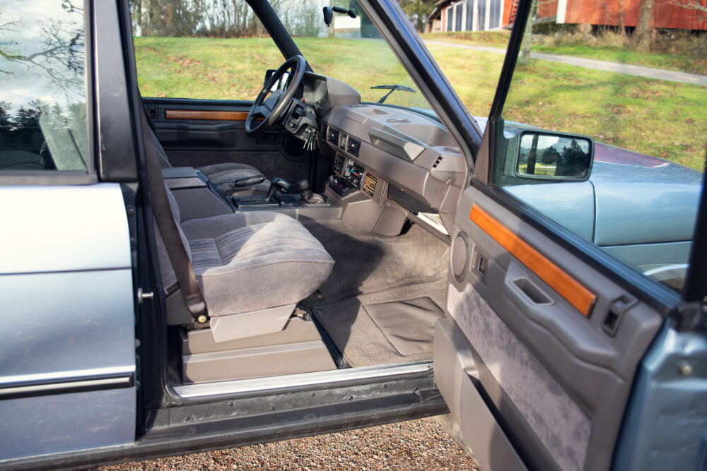 Vintage car interior with open driver door