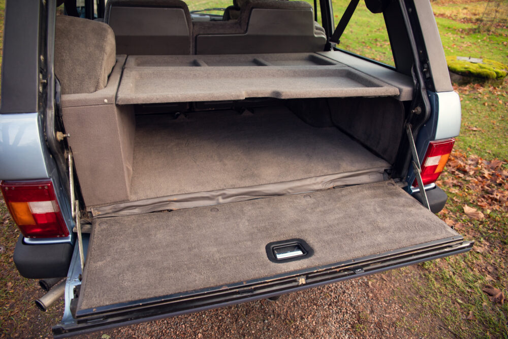 Open trunk of an SUV showing empty cargo space.